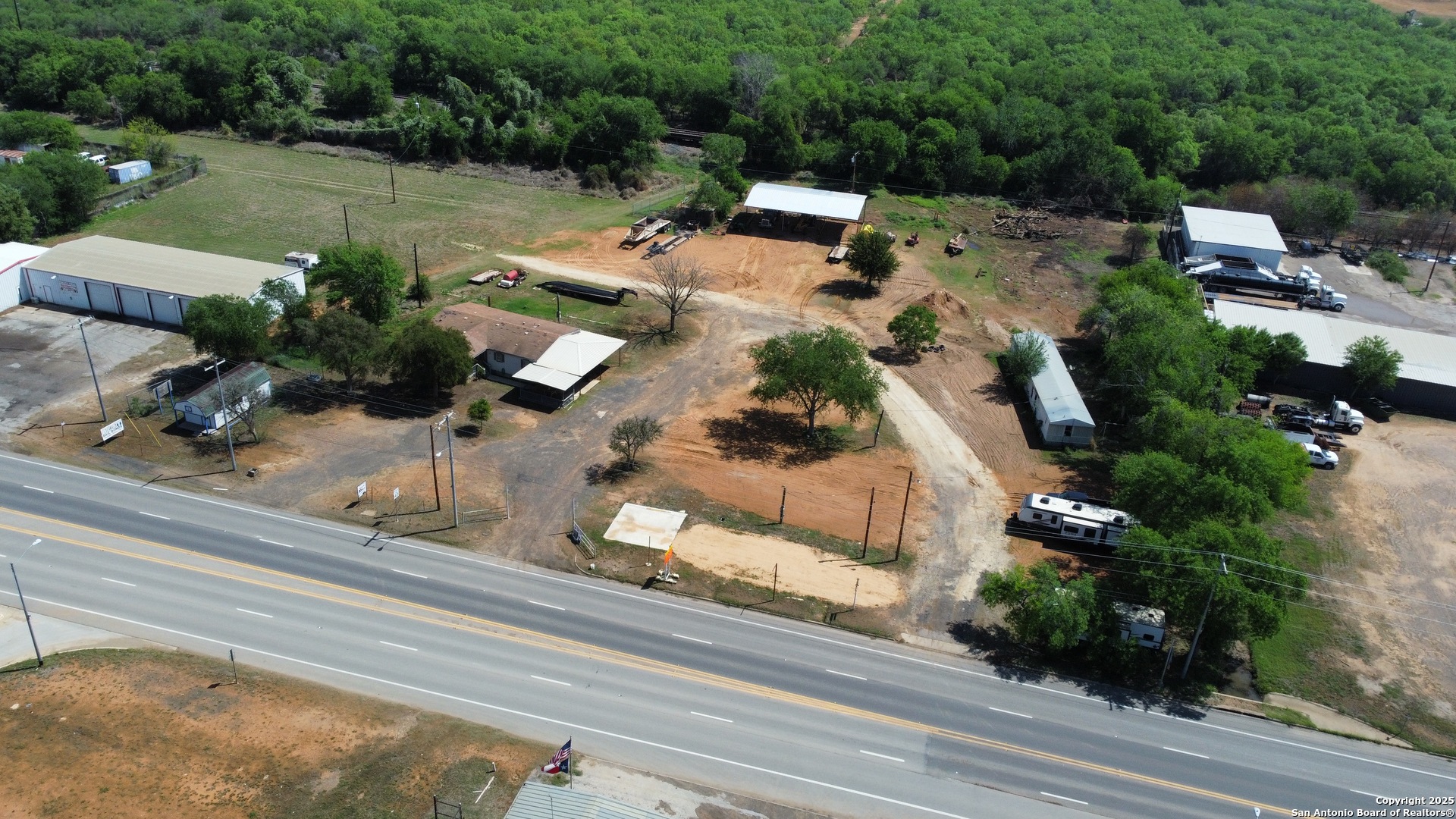 606 North Main Street Cotulla, TX 78014 - Photo 11 of 14 an aerial view of a house with garden space and street view