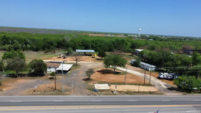 an aerial view of a house with outdoor space