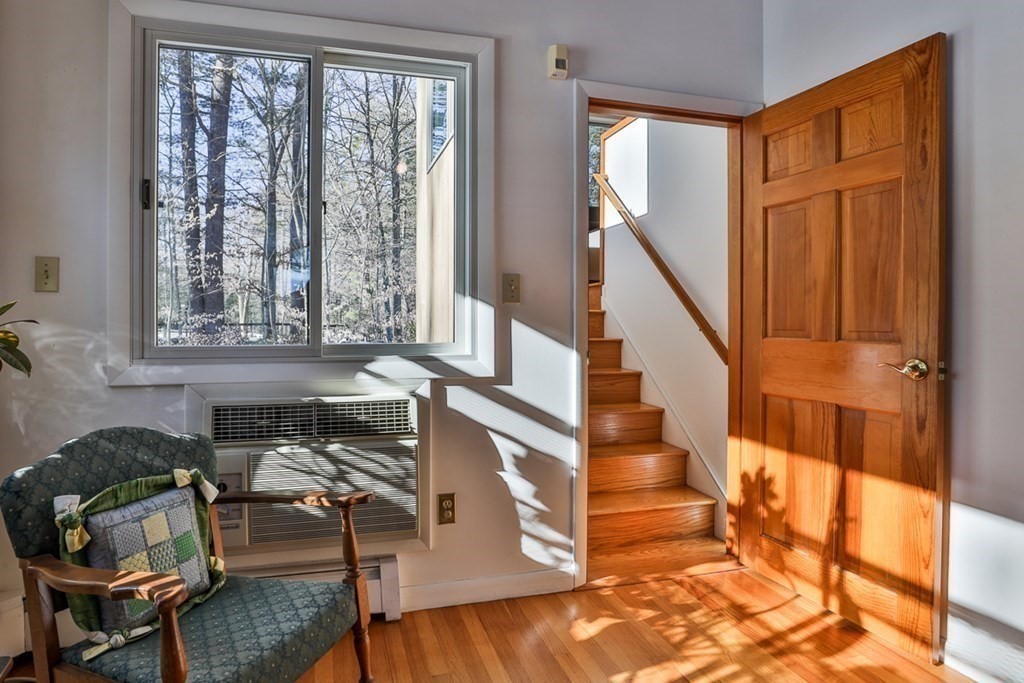 121 West Bare Hill Road Harvard, MA 01451 - Photo 20 of 36 a view of entryway and livingroom with furniture wooden floor and windows