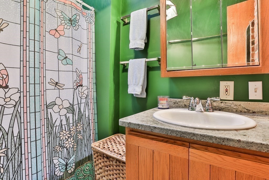 121 West Bare Hill Road Harvard, MA 01451 - Photo 27 of 36 a bathroom with a granite countertop sink and a mirror