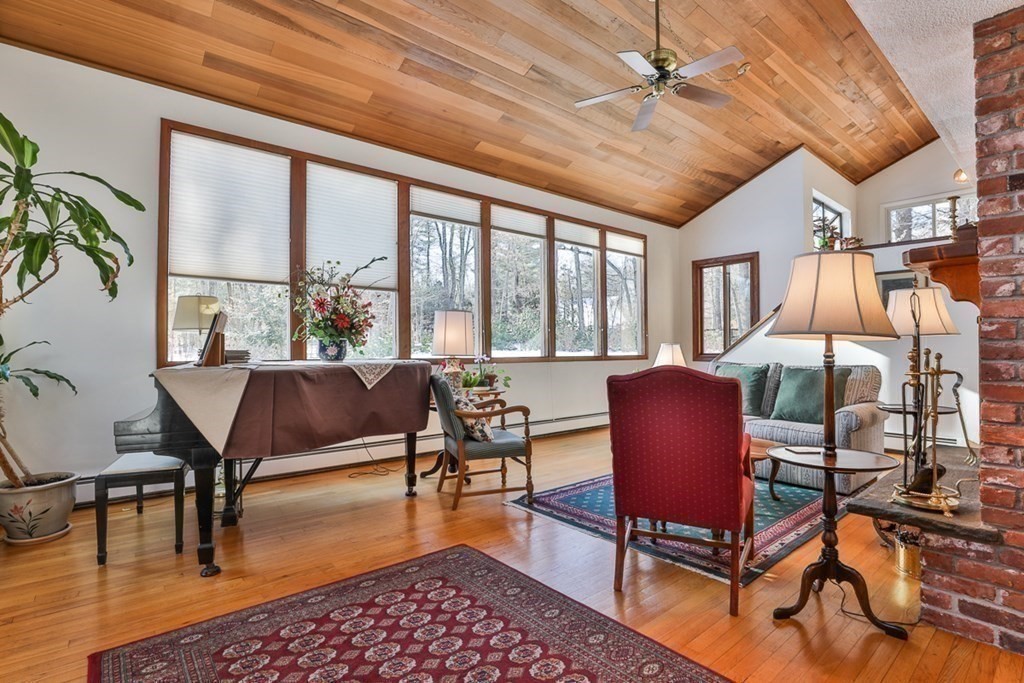 121 West Bare Hill Road Harvard, MA 01451 - Photo 5 of 36 a living room with furniture a rug potted plant and a large window