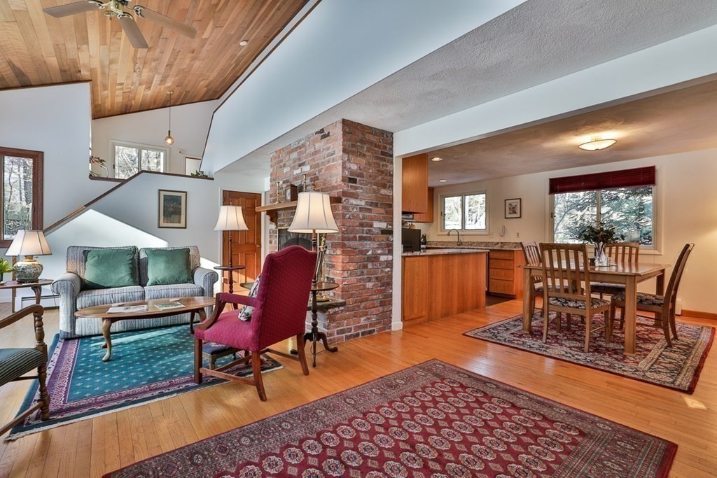 121 West Bare Hill Road Harvard, MA 01451 - Photo 8 of 36 a living room with furniture a rug and a table