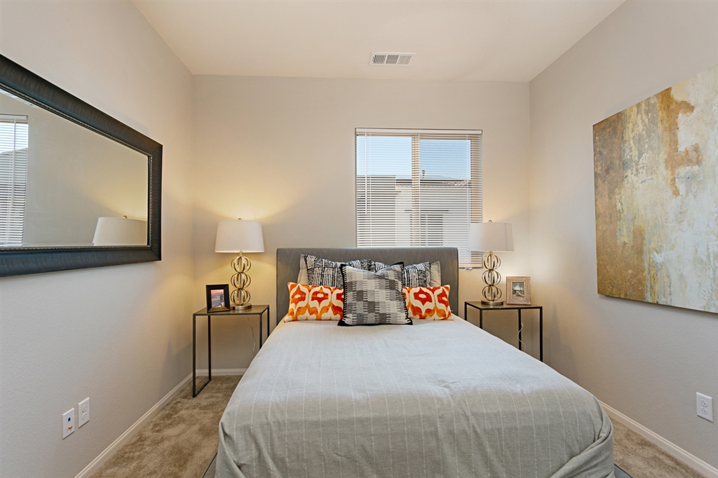 8850 Olive Lane, Unit 9 Santee, CA 92071 - Photo 12 of 17 The second bedroom, located on the 3rd level, has its own ensuite bathroom. This is a picture of the new furnished model.