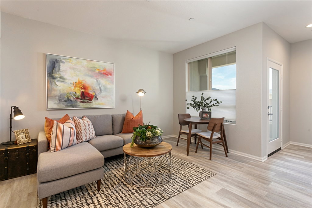 8850 Olive Lane, Unit 9 Santee, CA 92071 - Photo 3 of 17 The bright Great Room opens to both the private deck and contemporary kitchen. This is a picture of the new furnished model.