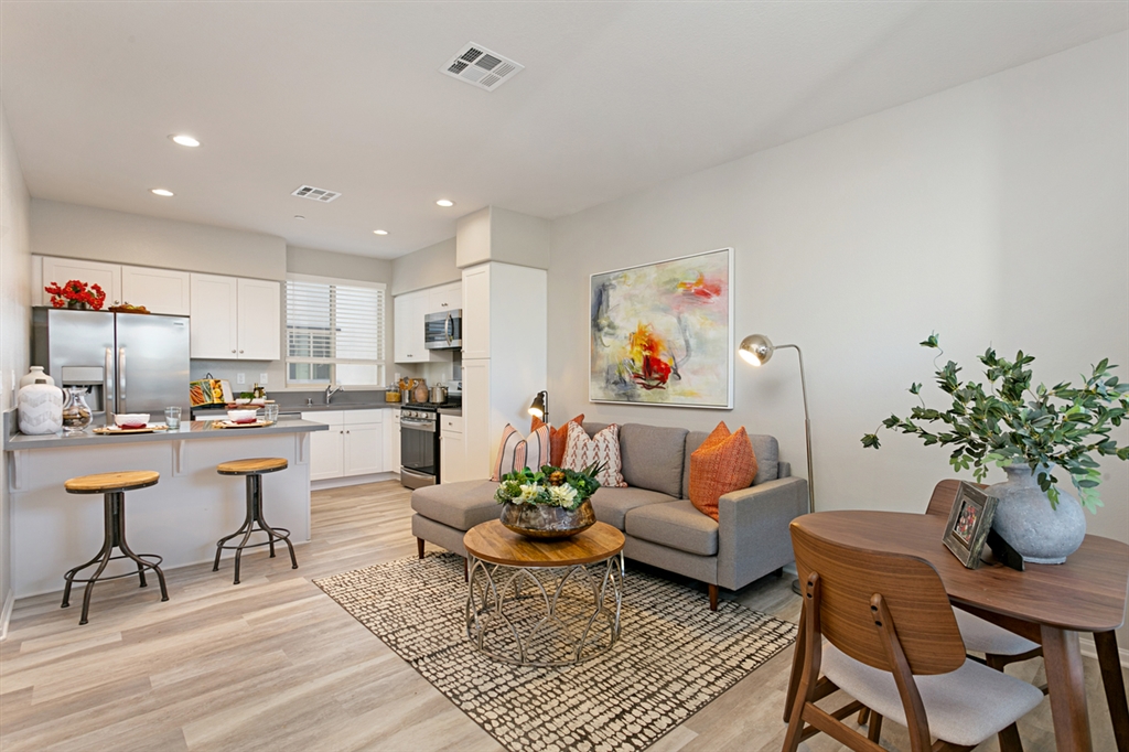 8850 Olive Lane, Unit 9 Santee, CA 92071 - Photo 4 of 17 Countertop seating at the kitchen adjoining the Great Room. This is a picture of the new furnished model.