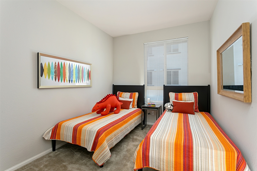 8850 Olive Lane, Unit 9 Santee, CA 92071 - Photo 7 of 17 The 3rd bedroom is located on the same level with the Great Room and is served by a 3rd full bath. This is a picture of the new furnished model.