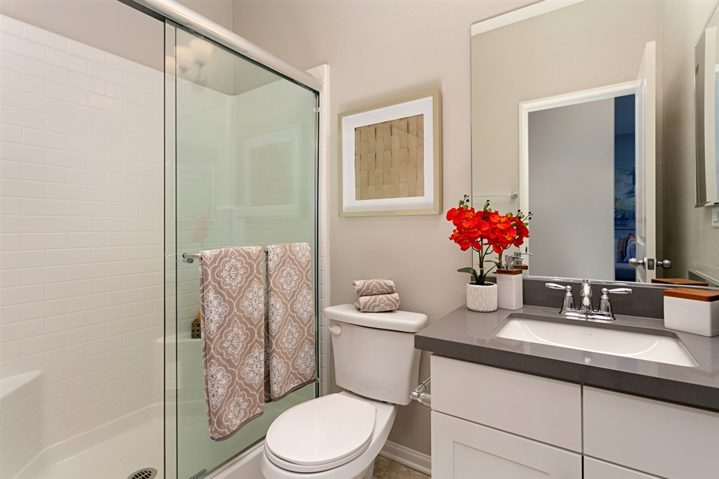 8850 Olive Lane, Unit 9 Santee, CA 92071 - Photo 8 of 17 The bathroom on the 2nd floor, Great Room level, includes a large shower with seat. This is a picture of the new furnished model.