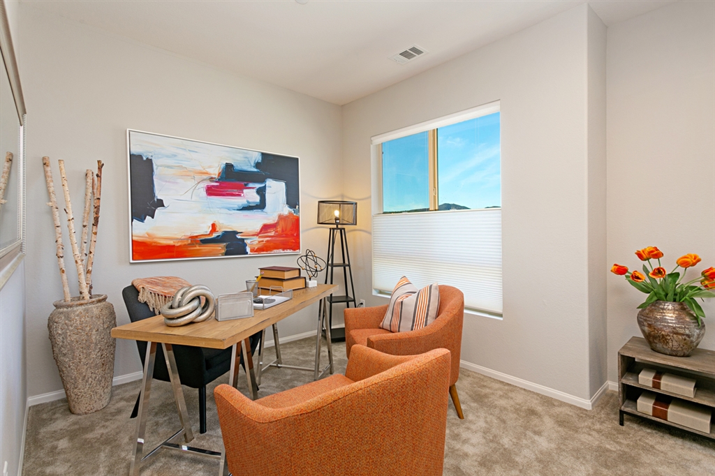 8850 Olive Lane, Unit 9 Santee, CA 92071 - Photo 9 of 17 The sunny study is located at the top of the stairs on the 3rd level. This bright room can be used for a variety of purposes including another entertaining space, home office, guest space, game room and more. This is a picture of the new furnished model.