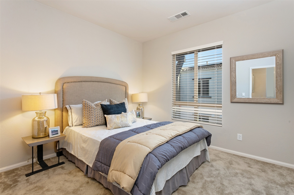 8850 Olive Lane, Unit 9 Santee, CA 92071 - Photo 10 of 17 The Master Bedroom includes 2 closets and an ensuite bathroom. This is a picture of the new furnished model.