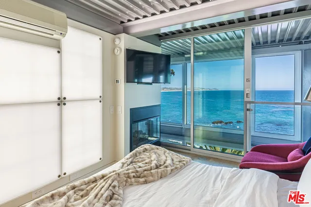 a bedroom with a bed window and walk in closet