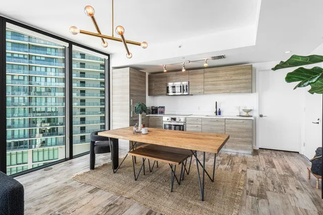 a view of a dining room with furniture window and wooden floor