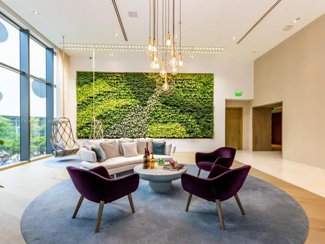 a hallway with table and chairs