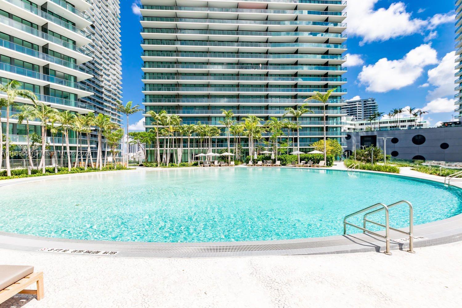 650 Northeast 32nd Street, Unit 1508 Miami, FL 33137 - Photo 33 of 37 a view of swimming pool with outdoor seating and plants