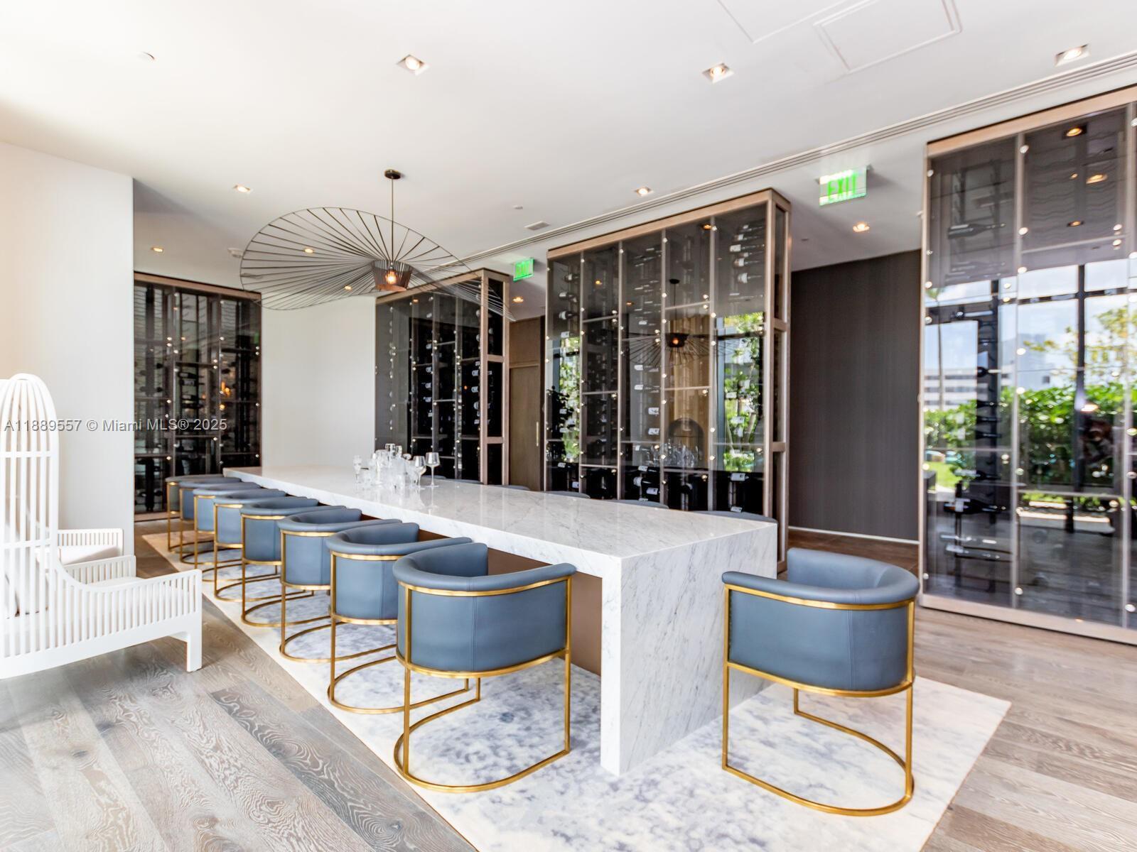 650 Northeast 32nd Street, Unit 1508 Miami, FL 33137 - Photo 35 of 37 a living room with furniture a window and a chandelier