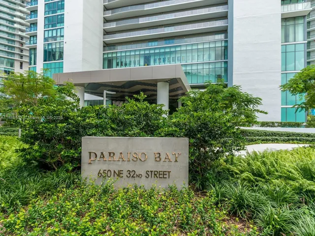 a building exterior with glass windows and door