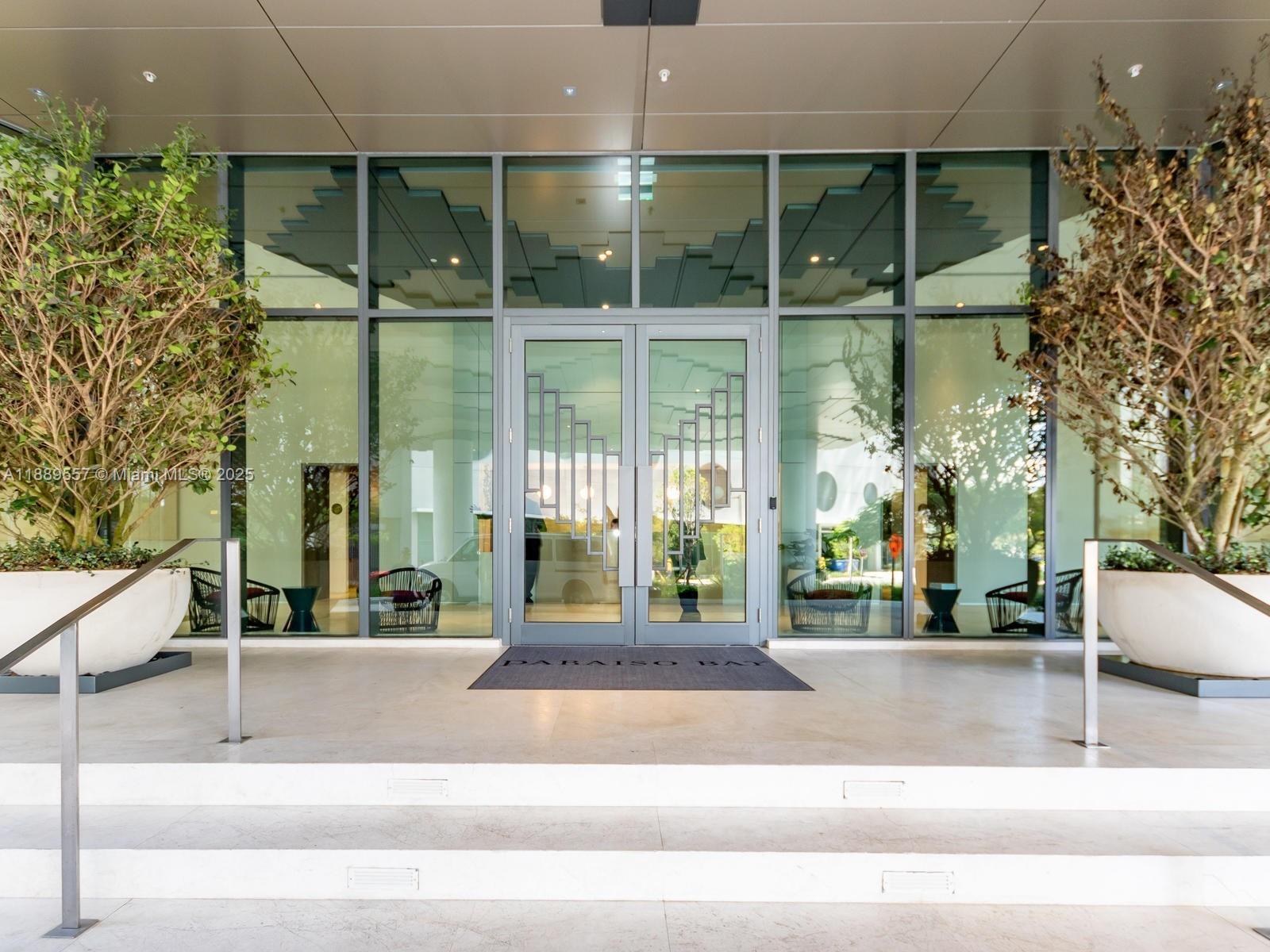 650 Northeast 32nd Street, Unit 1508 Miami, FL 33137 - Photo 37 of 37 a building exterior with glass windows and door