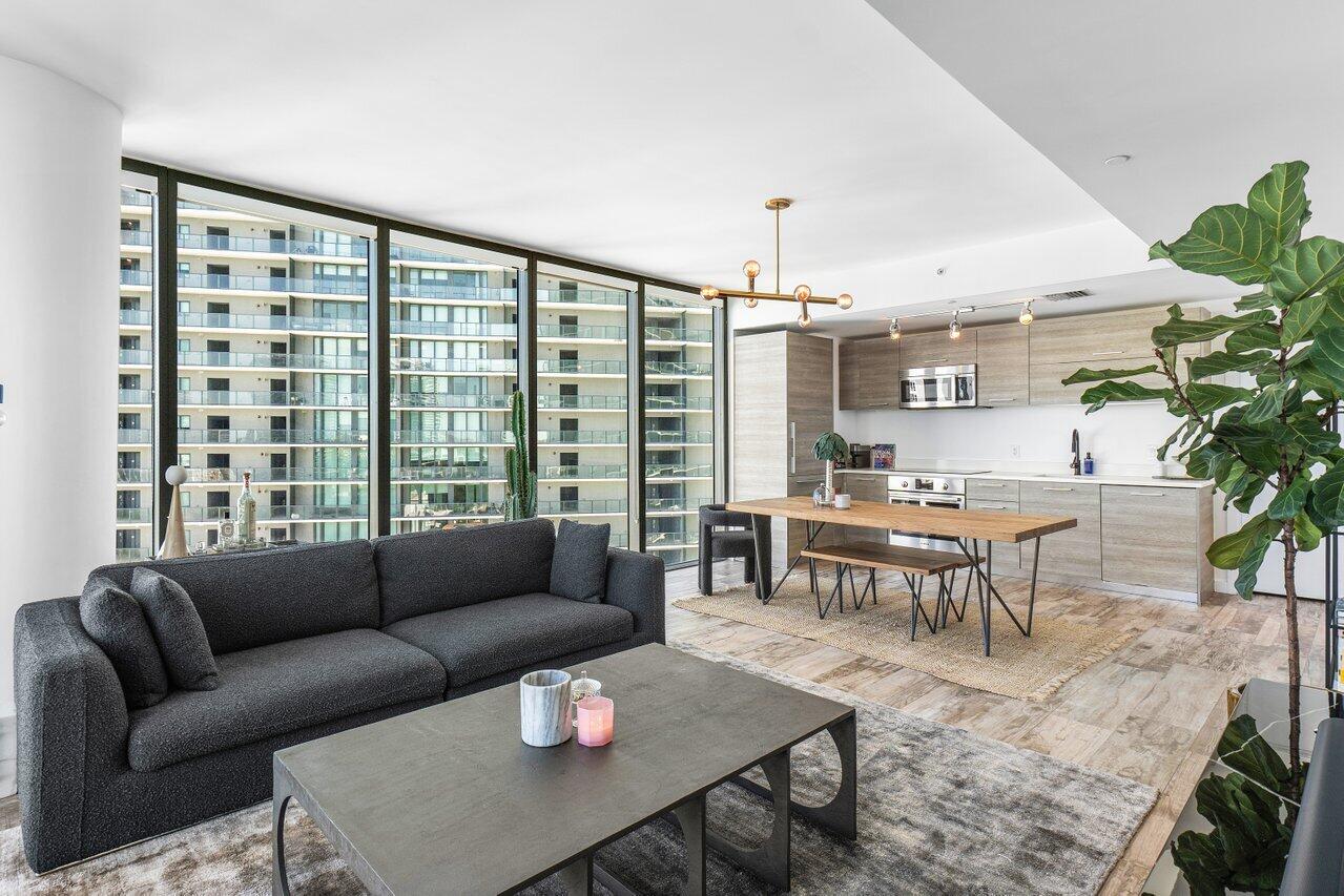 650 Northeast 32nd Street, Unit 1508 Miami, FL 33137 - Photo 8 of 37 a living room with furniture and a large window