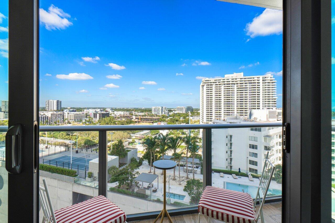 650 Northeast 32nd Street, Unit 1508 Miami, FL 33137 - Photo 10 of 37 a view of a balcony with couch and wooden floor