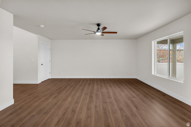 578 West 7th Midvale, UT 84047 - Photo 5 of 35 Spare room with dark wood-style floors and ceiling fan