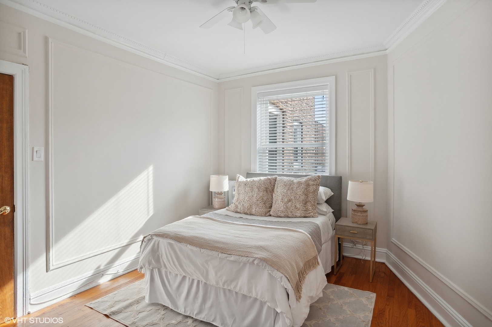 559 West Roscoe Street, Unit 2W Chicago, IL 60657 - Photo 12 of 23 a bedroom with a bed and a window