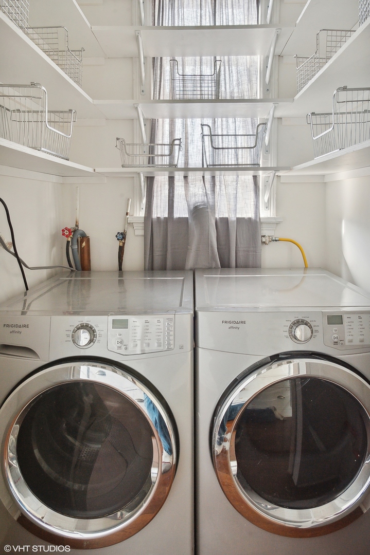 559 West Roscoe Street, Unit 2W Chicago, IL 60657 - Photo 16 of 23 a utility room with sink dryer and washer