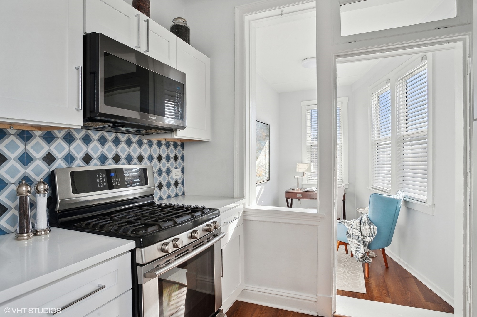 559 West Roscoe Street, Unit 2W Chicago, IL 60657 - Photo 19 of 23 a kitchen with a stove and a microwave