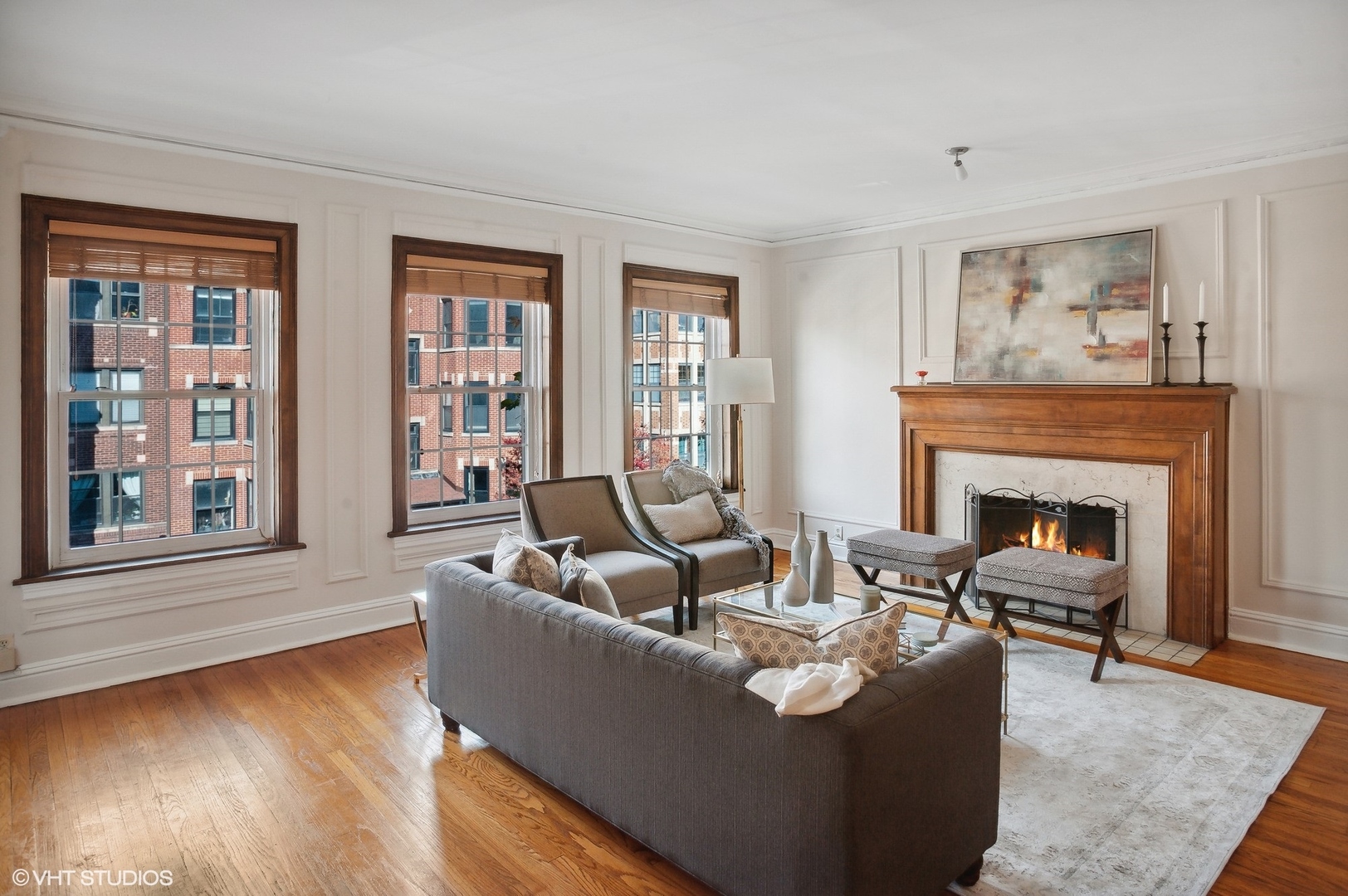 559 West Roscoe Street, Unit 2W Chicago, IL 60657 - Photo 2 of 23 a living room with furniture and a fireplace