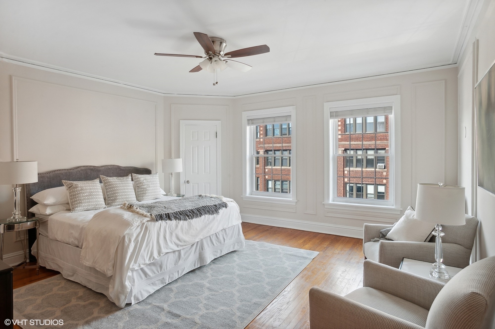 559 West Roscoe Street, Unit 2W Chicago, IL 60657 - Photo 7 of 23 a spacious bedroom with a bed a couch and a window