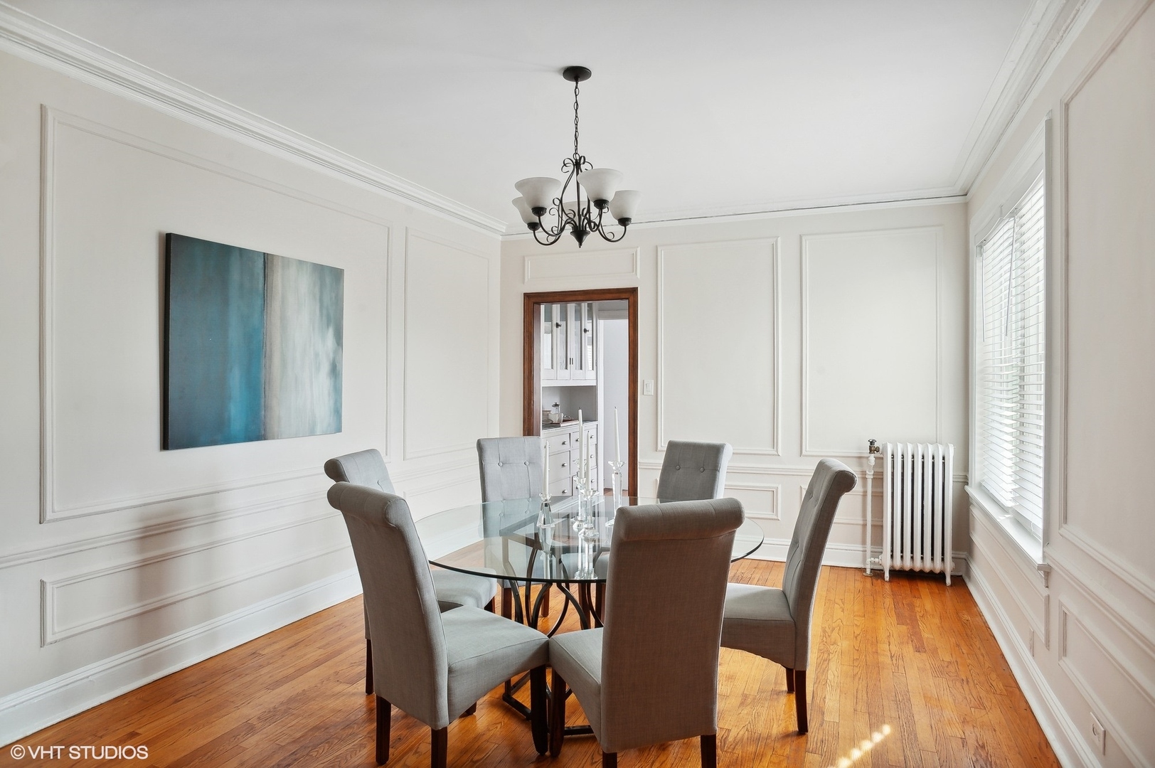 559 West Roscoe Street, Unit 2W Chicago, IL 60657 - Photo 10 of 23 a view of a dining room with furniture window and wooden floor
