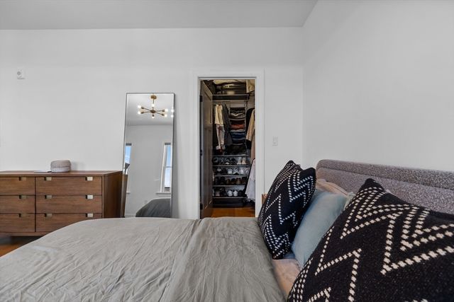 a bedroom with a bed and closet