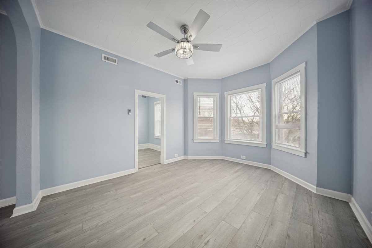 3134 West 39th Place, Unit 2 Chicago, IL 60632 - Photo 3 of 12 a view of an empty room with a window