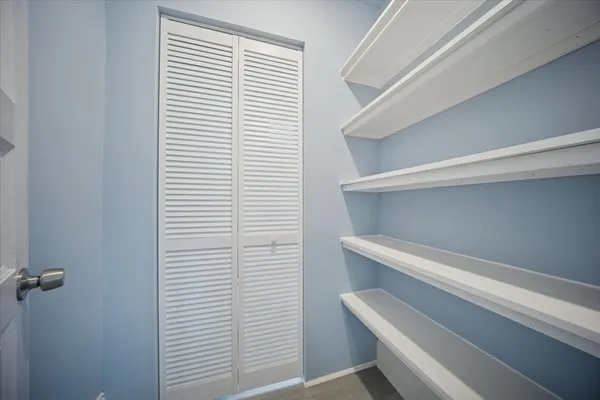 a view of small space with racks on the wall