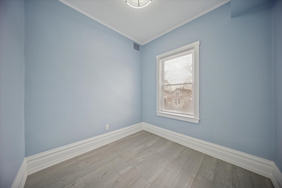 3134 West 39th Place, Unit 2 Chicago, IL 60632 - Photo 10 of 12 an empty room with a window