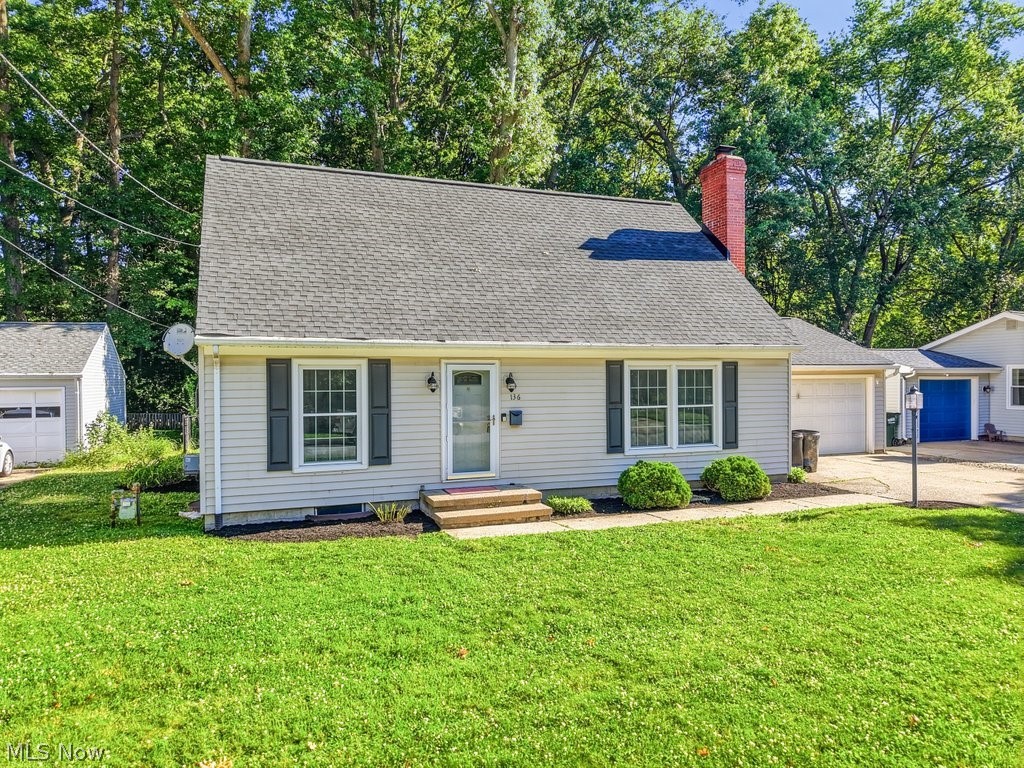136 Pinehurst Road Munroe Falls, OH 44262 - Photo 2 of 48 Light-toned siding exterior with dark shutters