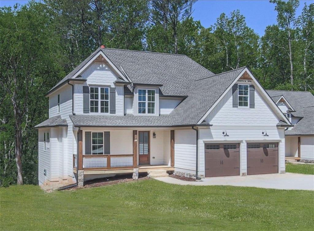 3585 Univeter Road Canton, GA 30115 - Photo 1 of 1 a front view of a house with a yard