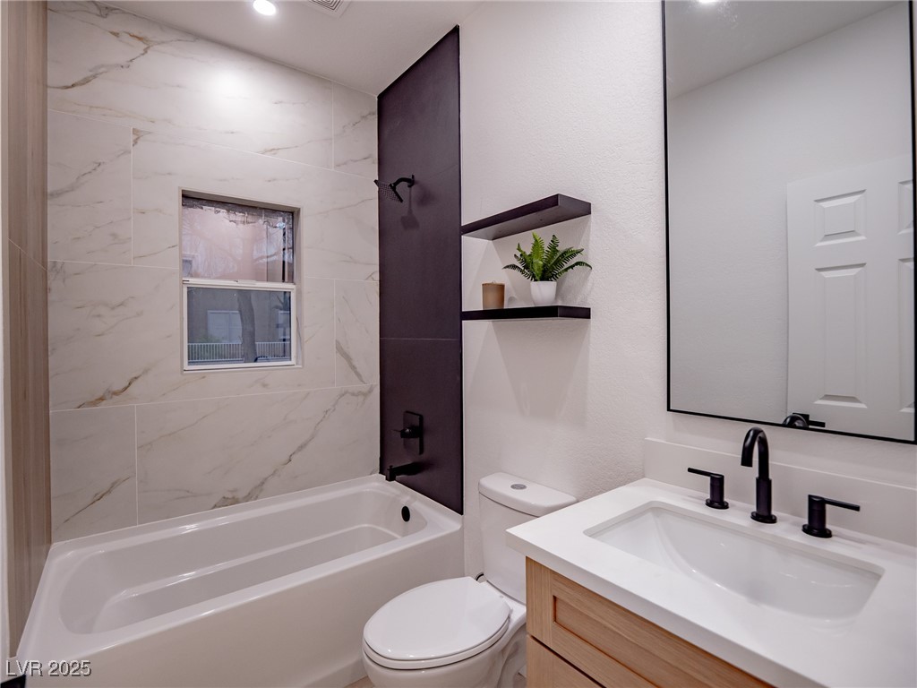 7870 Midnight Ride Street Las Vegas, NV 89131 - Photo 40 of 69 Full bathroom with washtub / shower combination and vanity