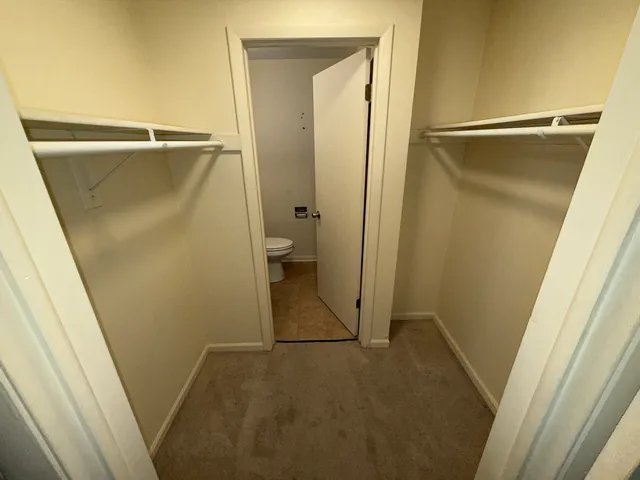 a bathroom with a granite countertop shower and a sink