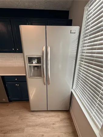 a view of a kitchen with a sink