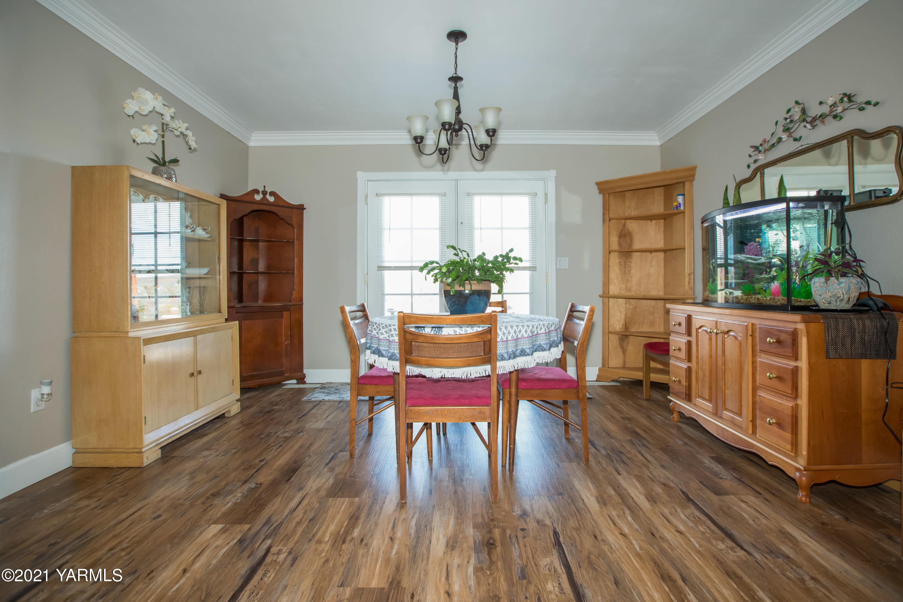 11401 Flintstone Road Yakima, WA 98908 - Photo 6 of 16 a view of a dining room with furniture window and wooden floor
