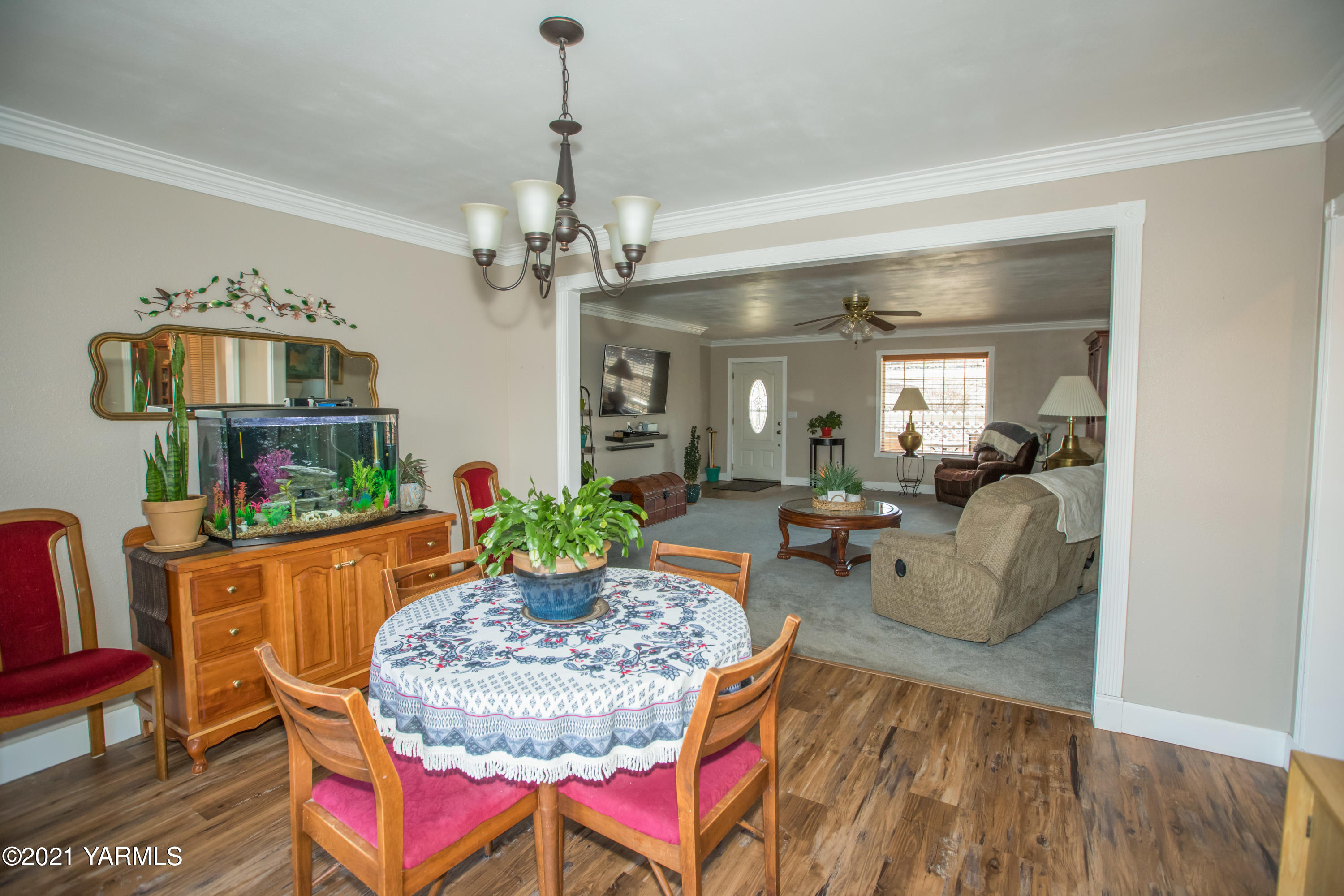 11401 Flintstone Road Yakima, WA 98908 - Photo 7 of 16 a living room with furniture and a chandelier