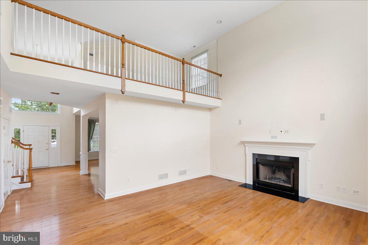 100 Caleb Lane Princeton, NJ 08540 - Photo 11 of 38 a view of empty room with wooden floor and fireplace