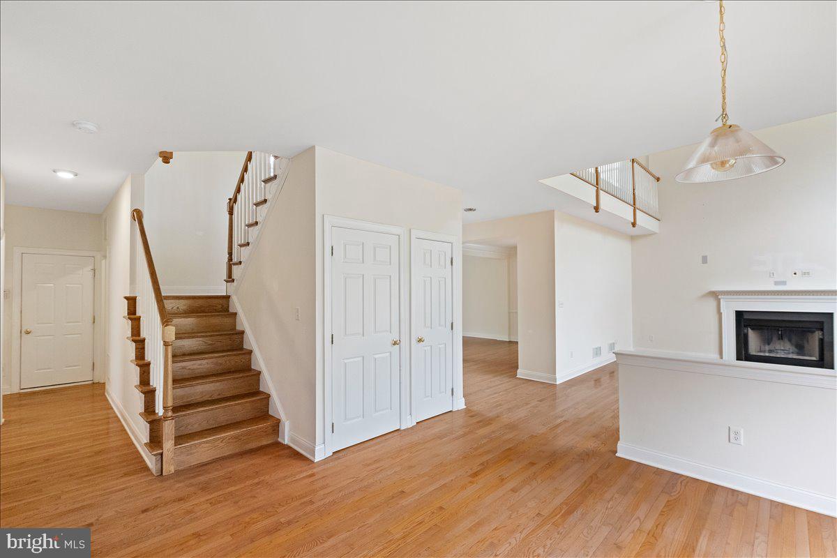 100 Caleb Lane Princeton, NJ 08540 - Photo 17 of 38 a view of a livingroom with wooden floor and a ceiling fan
