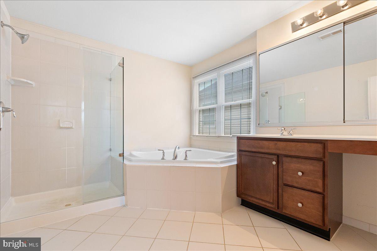 100 Caleb Lane Princeton, NJ 08540 - Photo 24 of 38 a bathroom with a sink mirror and a bathtub