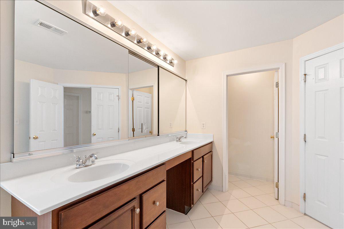 100 Caleb Lane Princeton, NJ 08540 - Photo 25 of 38 a bathroom with a sink and a mirror