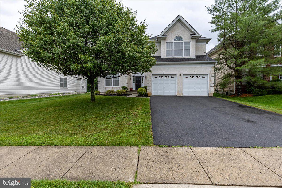 100 Caleb Lane Princeton, NJ 08540 - Photo 3 of 38 a front view of a house with a yard