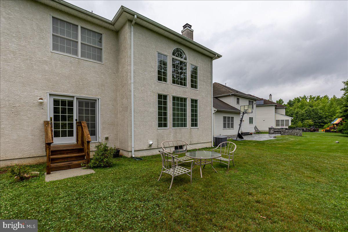100 Caleb Lane Princeton, NJ 08540 - Photo 38 of 38 a house view with a sitting space and garden