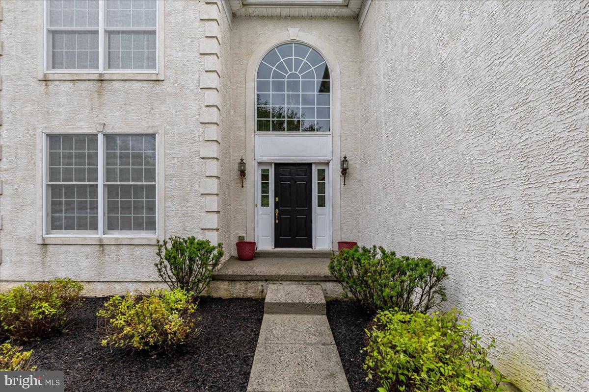100 Caleb Lane Princeton, NJ 08540 - Photo 4 of 38 a front view of a house with a garden