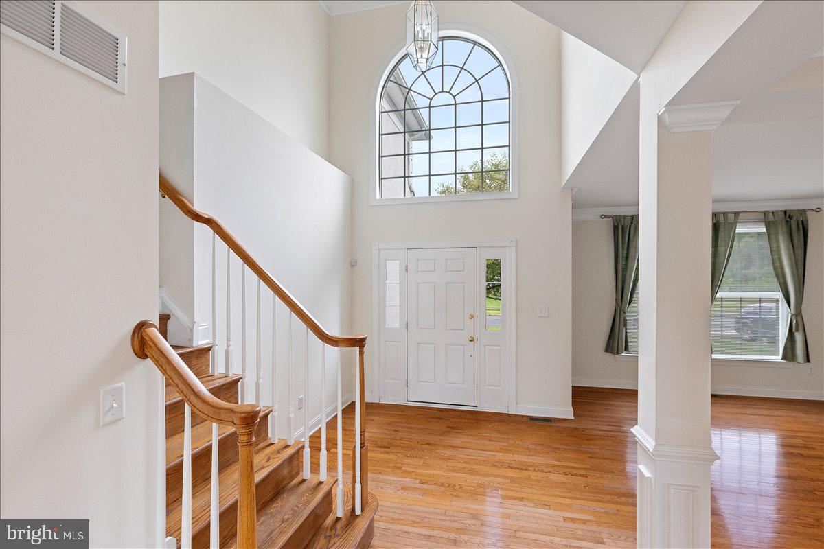 100 Caleb Lane Princeton, NJ 08540 - Photo 5 of 38 a view of an entryway with wooden floor and windows
