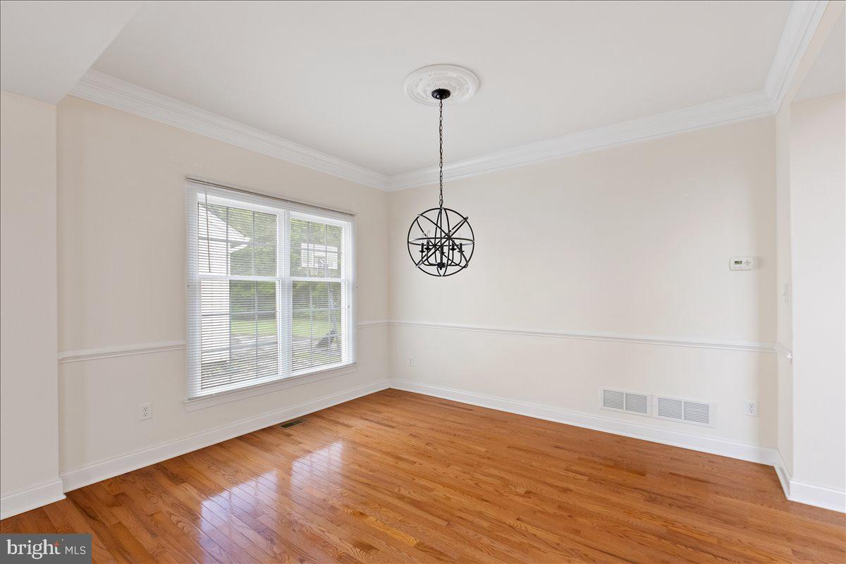 100 Caleb Lane Princeton, NJ 08540 - Photo 9 of 38 a view of a room with wooden floor and white walls