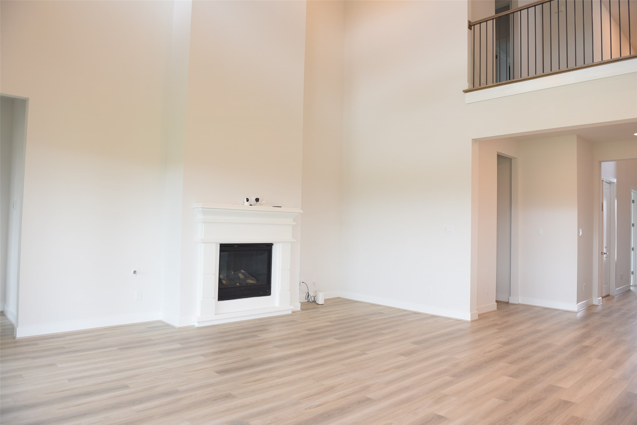 17507 Tulip Mdw Road Richmond, TX 77407 - Photo 13 of 47 a view of empty room with wooden floor and fireplace